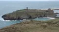 Peel castle, with ocean around it. Green hill in the foreground HD Footage