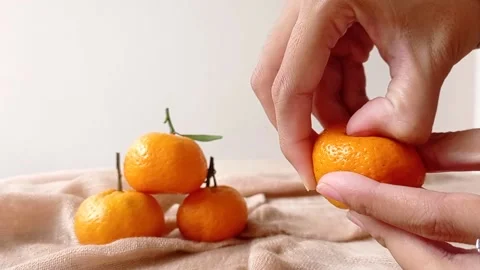 Peel off fresh orange fruit on a table Stock Footage 146260005