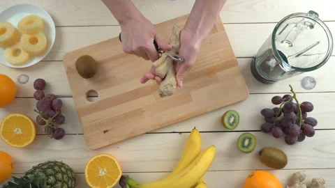 Peel ginger for smoothie, top view Stock Footage 85526662