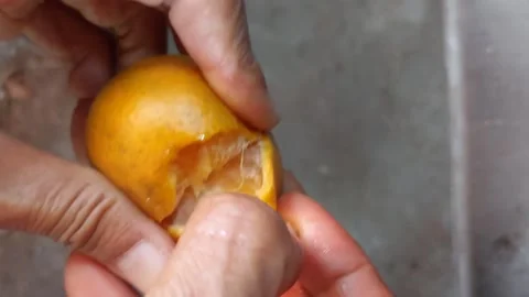 Peel the oranges by hand Stock Footage 264808004