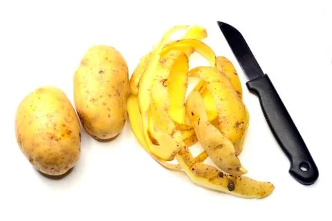 Peel potatoes Stock Photos