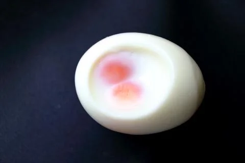 Peel off shell boiled twin egg. Stock Photos
