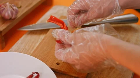 Peel a squash, grate it and squeeze the juice. Homemade chili sauce. 4k video Stock Footage 164972999