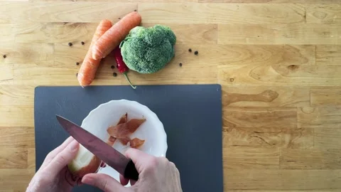 Peel vegetables onion top view Stock Footage 228432882