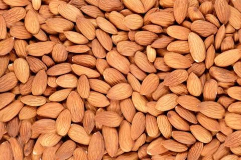 Peeled almonds background Stock Photos