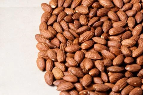 Peeled almonds in background Stock Photos