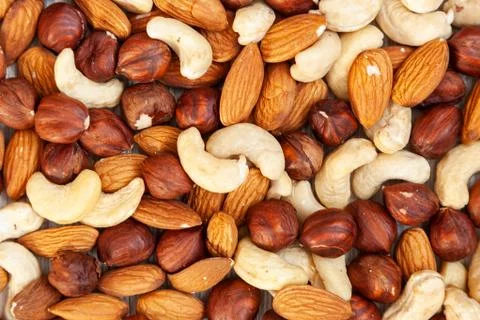 Peeled  almonds, cashew,  hazelnut   pattern. Macro background texture of fro 스톡 사진