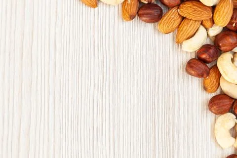 Peeled  almonds, cashew,  hazelnut   pattern. Macro background texture of fro 스톡 사진