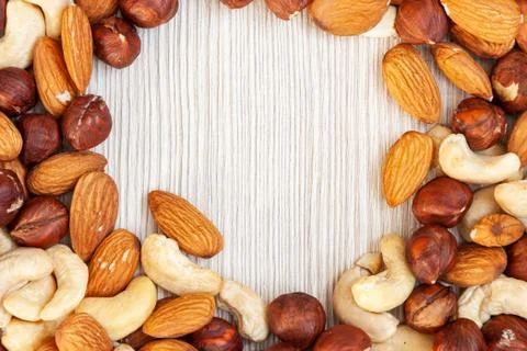 Peeled  almonds, cashew,  hazelnut   pattern. Macro background texture of fro 스톡 사진