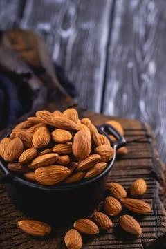 Peeled almonds closeup. Stock Photos