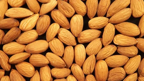Peeled almonds kernels is circling Stock Footage 141977284