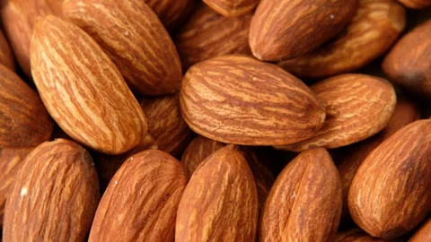 Peeled almonds nuts closeup rotating, macro shot Stock Footage 125292108