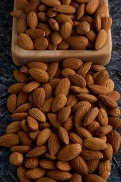 Peeled almonds put a slide on the table Stock Photos