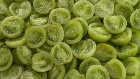 Peeled and halved green grape cherry tomatoes background texture. Stock Footage 342848310