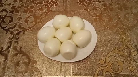 Peeled boiled eggs on a plate Stock Footage 227295768
