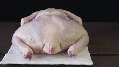 Peeled broiler chicken on a black background 库存影片 132882852