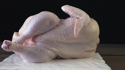 Peeled broiler chicken on a black background Vidéo 132883060