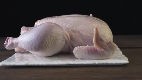 Peeled broiler chicken on a black background Stock Footage 132883926