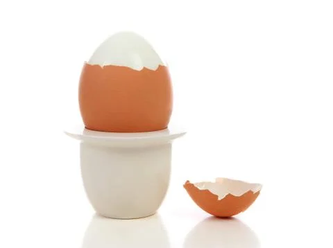 Peeled egg in holder Stock Photos