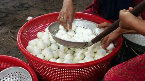The peeled eggs are ready to be fried. 4K. Stock Footage 204079965