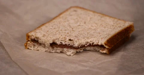 Peeled fresh hazelnuts and bread with nut paste with chocolate, delicious and Stock Footage 287680611