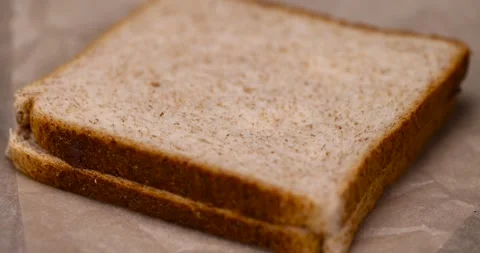 Peeled fresh hazelnuts and bread with nut paste with chocolate, delicious and Stock Footage 292393767