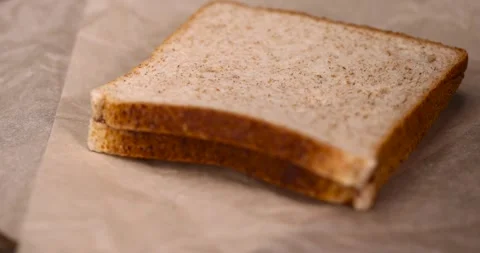 Peeled fresh hazelnuts and bread with nut paste with chocolate, delicious and Stock Footage 293449187