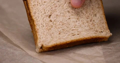 Peeled fresh hazelnuts and bread with nut paste with chocolate, delicious and Stock Footage 294462296