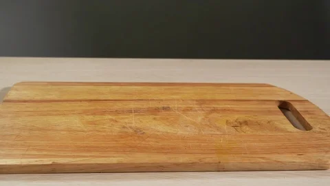 Peeled fruit apple slices fall kitchen table slowmotion, displayed closeup Stock Footage 113071361