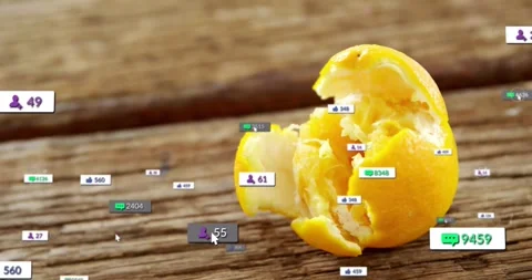 Peeled fruit on plank, cursor spawning social media badges drifting toward fruit Stock Footage 331570786
