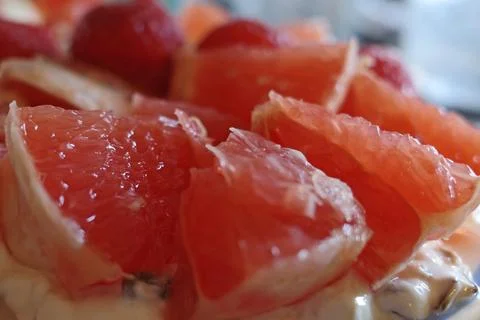 Peeled grapefruit close-up Stock Photos