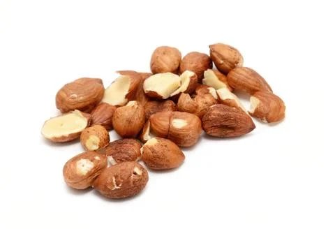 Peeled hazelnuts over white background. 스톡 사진
