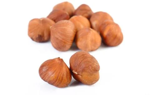 Peeled hazelnuts Stock Photos
