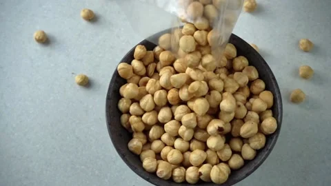Peeled light blanched hazelnuts Stock Footage 199042437