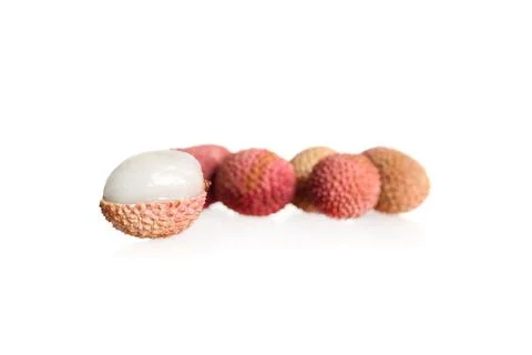 Peeled lychee fruit with selective focus on a white isolated background Foto stock