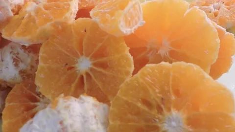Peeled mandarin oranges, also known as tangerines or satsumas. These are a t Stock Footage 327363034