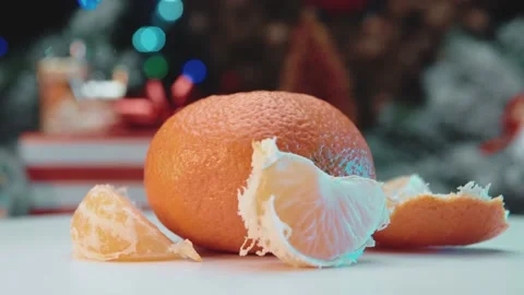 A peeled mandarin is spinning on a white table. Stock Footage 145165957
