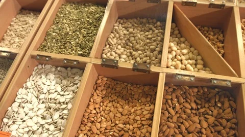 Peeled nuts and seeds in boxes. Stock Footage 82355519