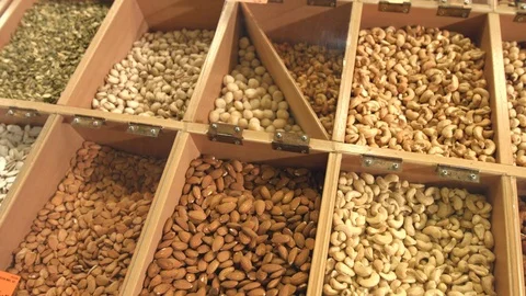 Peeled nuts and seeds in boxes. Video stock 82355654