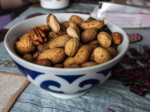 Peeled nuts in a plate on the table, macro Stock Photos