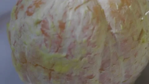 Peeled orange rotating Stock Footage 172335293