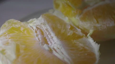 Peeled orange slices Stock Footage 172334577