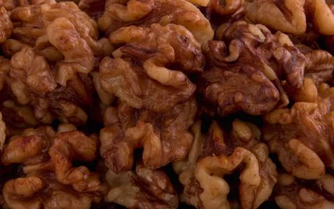 Peeled organic fresh walnuts pattern macro top look Stock Photos