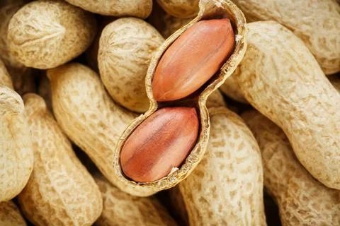 Peeled peanut on well peanuts. Peanuts, for background or textures. Stock Photos