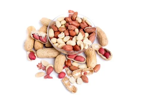 Peeled peanuts and peanut pod isolated on white background. Stock Photos