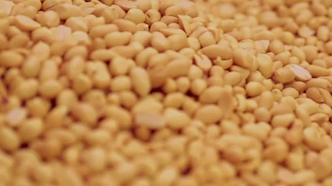 Peeled Peanuts are fried in beautiful slow motion Stock Footage 76894682