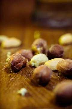 Peeled peanuts on a light surface. Stock Photos