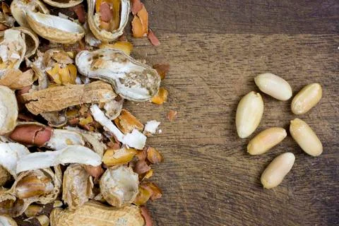 Peeled peanuts, nutshells Stock Photos