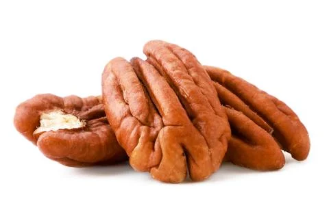 Peeled pecan nuts close-up on a white. Isolated Stock Photos
