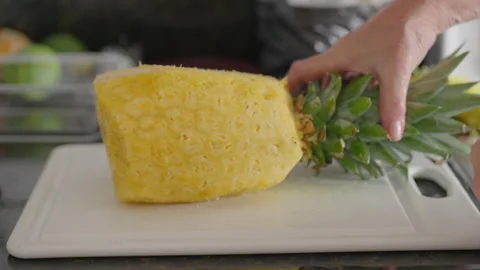 Peeled Pineapple on a Cutting Board Stock Footage 315294848